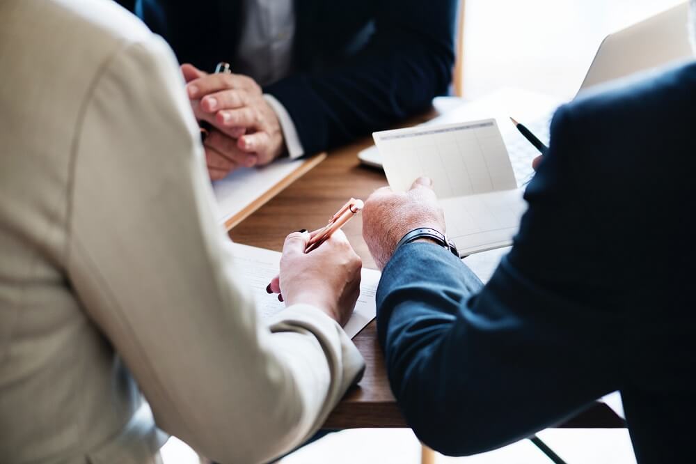 people working at a desk 