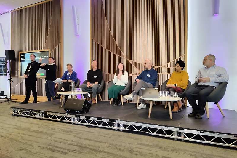 Inclusion experts meeting at a conference including Chris Lewis